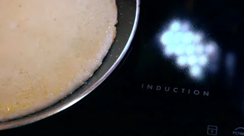 Induction cooker. Cooking. Stock Footage 68578468