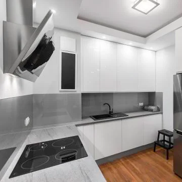 Induction hob in kitchen Stock Photos