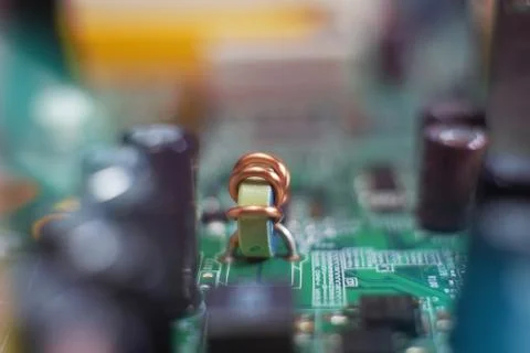Inductor installed on electronic circuit Stock Photos