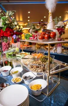 Indulge in a delectable array of salads, vegetables, and snacks, artfully pre Stock Photos