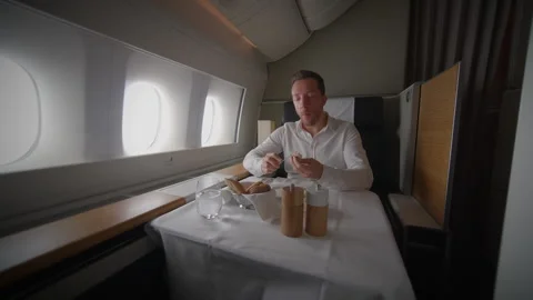Indulge in a Luxury InFlight Dining Experience While Traveling in First Stock Footage 319905564