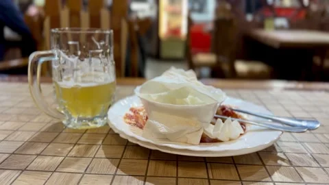 Indulge in a Refreshing Drink and Decadent Dessert in a Cozy and Inviting Stock Footage 316478239