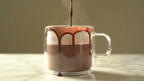 Indulgence in every drop. 🍫☕ Rich hot chocolate, slow motion steam, and luxury  Stock Footage 315336096