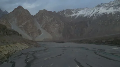 Indus River flowing through mighty mountains of Hunza Valley near passu village Stock Footage 245179344