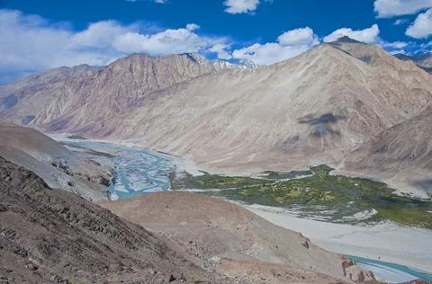 Indus river flowing through mountains at Leh outskirts, Ladakh, India Stock Photos