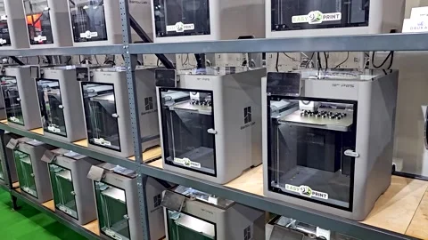 Industrial 3D Printer Farm with Rows of Professional Bambu Lab Printers Stockbeeldmateriaal 337342805