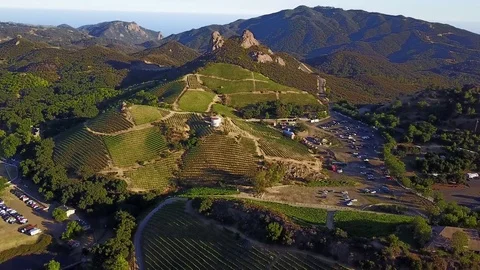Industrial aerial winery in the mountains of California at sunset Stock Footage