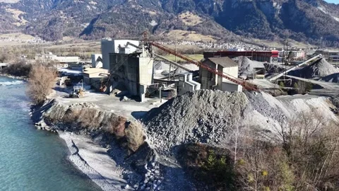 Industrial aggregate processing facility located next to the Rhine river 스톡 동영상 329506040