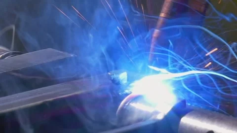 Industrial Argon Welding Robot Creating Bright Sparks in Slow Motion Stock Footage 340486661