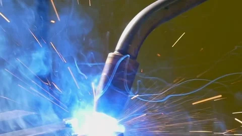 Industrial Argon Welding Robot at Work Creating Sparks in Slow Motion Stock Footage 341068395