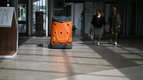 Industrial automatic robot cleaner mopping the floor in the Mall Stock Footage 133553183
