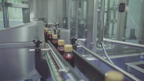 Industrial Automation and Quality Control Sensor on Bottle Packaging Conveyor Stock Footage 340600832