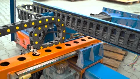 Industrial automation with moving linear guide and cable carrier chain mechanism Stock Footage 341555392