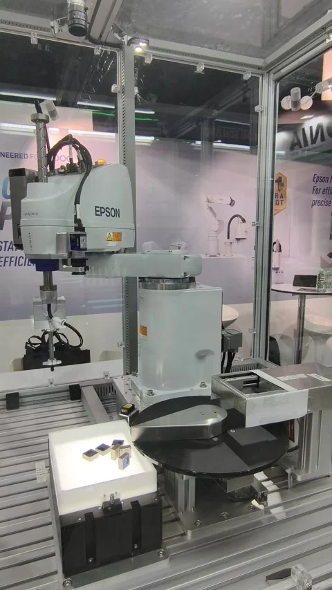 An industrial automation setup featuring a SCARA Stock-Footage 336839123