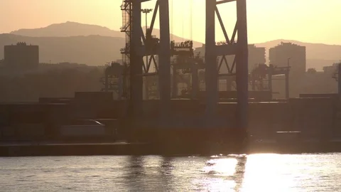 Industrial Backgrounds - Sunset View of a Big Container Crane Stock Footage 72186112