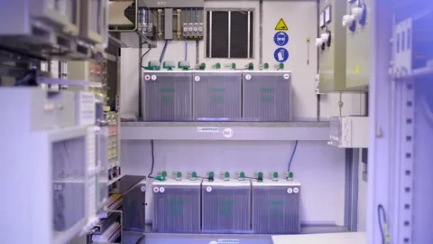 Industrial Battery Bank Setup in Electrical Control Cabinet Room for Backup Powe Stock Footage 334053706