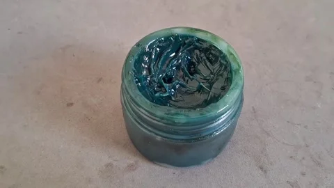 Industrial blue grease inside open container for mechanical motion video Stock Footage 336466138