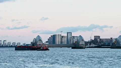 Industrial boat pulling cargo containers on the river Thames Stock Footage 297108191