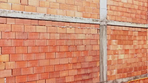 Industrial brick wall backdrop. Textured concrete and brick construction detail. Stock Footage 337873549
