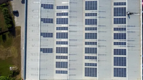 Industrial building exterior with vertically integrated photovoltaic solar panel Stock Footage 341579745