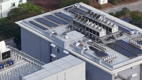 Industrial building rooftop featuring solar panels and hvac system 스톡 동영상 329085634