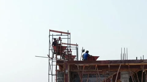 Industrial Building Site Activity with Construction Personnel Operating Stock Footage 344230116