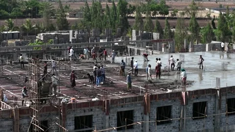 Industrial Building Site Activity with Construction Personnel Operating Stock Footage 344477641