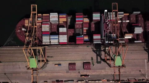 Industrial Cargo area with container ship in dock at port, Aerial view Video stock 95627872