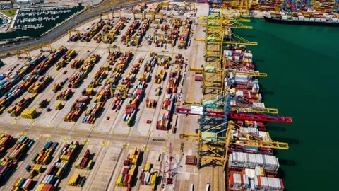 Industrial Cargo area with container ship in dock at port, Aerial view Stock Footage 99753371