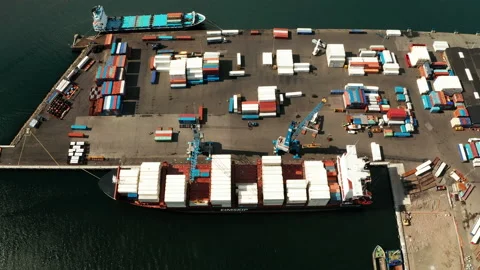Industrial Cargo area with container ship in dock at port, Aerial view Stock Footage 167881983