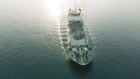 Industrial cargo freighter ship leaving port, aerial view Stock Footage 111503511