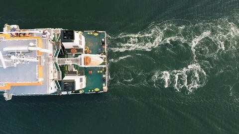 Industrial cargo freighter ship leaving port, top down aerial view Stock Footage 111503592