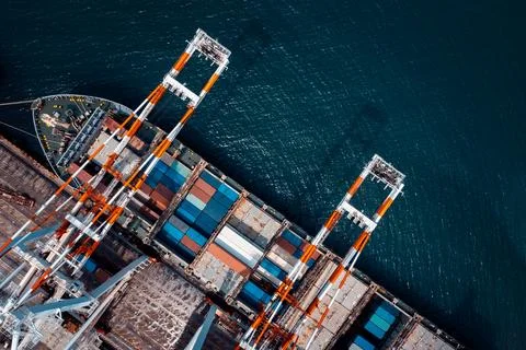 Industrial Cargo Ship Loading Freight Containers At Harbor Terminal High An.. Stock Photos