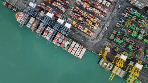 Industrial Cargo Ship Loading Freight Containers At Maritime Port High Angl.. Stock Photos