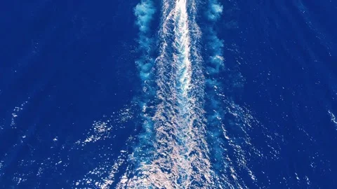 Industrial cargo ship sailing through open ocean Stock Footage 335646864