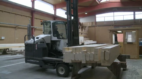 Industrial carpentry forklift truck lifting wooden beams Video stock 59129519