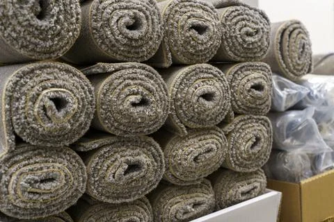 Industrial carpet production and storage with large rolls of textile flooring Fotos de archivo