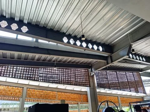 Industrial Ceiling With Brick Patterns and Modern Lighting Stock Photos