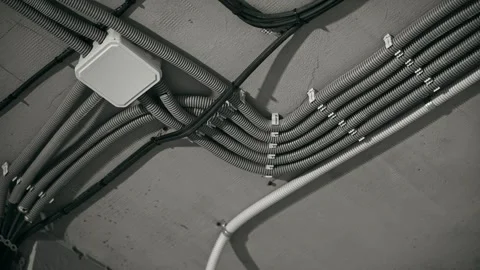 Industrial Ceiling Setup Equipped With Junction Box And Numerous Conduit Stock Footage 323583293