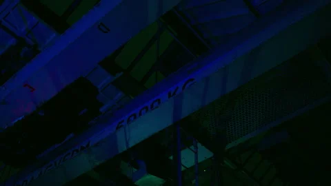 Industrial Ceiling Structure with Neon Blue and Green Ambient Lighting Stock Footage 330998982