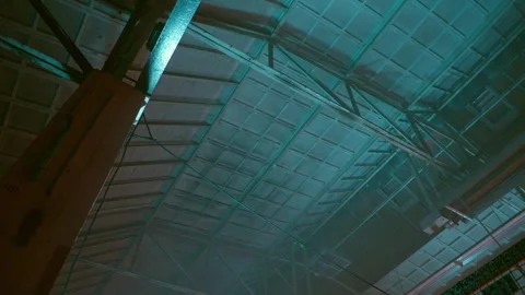 Industrial Ceiling Structure with Neon Blue and Green Ambient Lighting Stock Footage 330999872