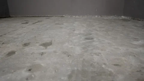 Industrial Cement Floor Background. Low angle dolly shot moves slowly across Stock Footage 335157937