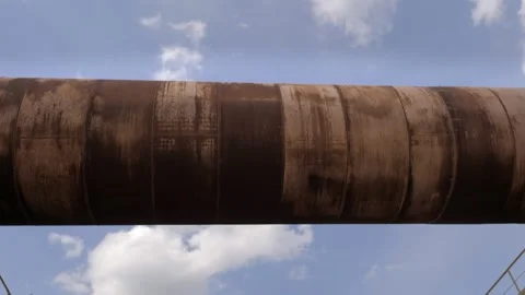 An industrial cement processing facility. Rotating furnace equipment at the Video stock 156389706