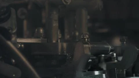 Industrial cheesemaking machine processing dairy products in a factory Stock Photos