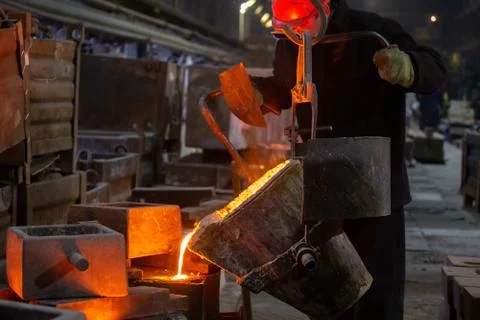 Industrial chill casting. The process of for filling out mold with molten metal. Stock Photos