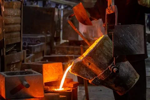 Industrial chill casting. The process of for filling out mold with molten m.. Stock Photos