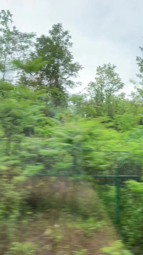 Industrial chimney seen from a moving train at night, China Stock Footage 341666892