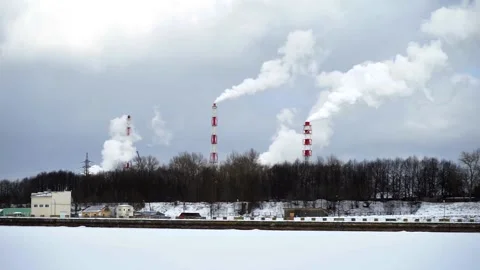 Industrial chimneys with heavy smoke causing air pollution Stock Footage 201323042