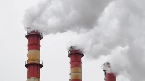 Industrial chimneys with heavy smoke causing air pollution Stock Footage 262623969