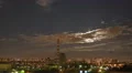 The industrial city landscape with thunderstorm clouds and bright moon at night 4k or 4k+ Resolution